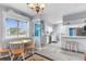 Bright dining area with a table and four chairs, adjacent to the kitchen at 5421 Circle Dr, Weeki Wachee, FL 34607