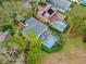 Two houses with private pools, viewed from above at 5608 Rockfield Loop, Valrico, FL 33596