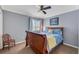 Bedroom with wood sleigh bed and neutral decor at 5608 Rockfield Loop, Valrico, FL 33596