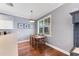 Charming dining area with wood table and four chairs near kitchen at 5608 Rockfield Loop, Valrico, FL 33596