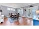 Formal dining room featuring hardwood floors and a charming chandelier at 5608 Rockfield Loop, Valrico, FL 33596