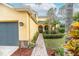 Brick walkway leads to double doors with glass inserts; a bench sits on the porch at 5608 Rockfield Loop, Valrico, FL 33596