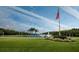 Landscaped area with lake and fountain at 5608 Rockfield Loop, Valrico, FL 33596