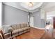 Relaxing living room featuring hardwood floors and a comfortable sofa at 5608 Rockfield Loop, Valrico, FL 33596