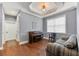 Cozy living room with hardwood floors and a piano at 5608 Rockfield Loop, Valrico, FL 33596