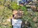 Aerial view showing house and surrounding trees at 5620 Montana Ave, New Port Richey, FL 34652