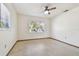 Bright bedroom with ceiling fan and carpet at 5620 Montana Ave, New Port Richey, FL 34652