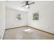 Bedroom with ceiling fan and carpeted floor at 5620 Montana Ave, New Port Richey, FL 34652