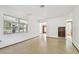 Simple living room with tile floor and a built-in bookshelf at 5620 Montana Ave, New Port Richey, FL 34652