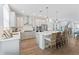 Modern kitchen with gray cabinets, quartz countertops, and island at 5636 Silver Sun Dr, Apollo Beach, FL 33572