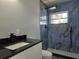 Modern bathroom with updated shower and vanity at 6413 N 48Th St, Tampa, FL 33610