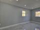 Bright bedroom with large window and tile flooring at 6413 N 48Th St, Tampa, FL 33610