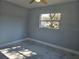 Bedroom with window and ceiling fan, offering natural light at 6413 N 48Th St, Tampa, FL 33610