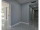 Clean and bright hallway with marble-look tile floors at 6413 N 48Th St, Tampa, FL 33610