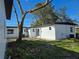 Rear view of a freshly painted house with sliding glass doors at 6413 N 48Th St, Tampa, FL 33610