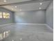 Spacious living area with gray walls and marble-look floors at 6413 N 48Th St, Tampa, FL 33610