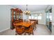 Formal dining room with traditional wood furniture, chandelier lighting, and natural light, great for entertaining at 6909 13Th N Ave, St Petersburg, FL 33710