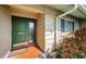 Inviting front entryway featuring a classic painted door, tiled flooring, and neatly landscaped surroundings at 6909 13Th N Ave, St Petersburg, FL 33710