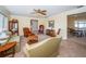 Bright and airy living room with a ceiling fan, neutral walls, and lots of natural light at 6909 13Th N Ave, St Petersburg, FL 33710