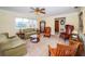 Bright and airy living room with a ceiling fan, neutral walls, and lots of natural light at 6909 13Th N Ave, St Petersburg, FL 33710