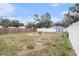 Large backyard with fire pit and storage shed at 8907 N Boulevard, Tampa, FL 33604