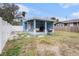 Fenced backyard with patio and grill at 8907 N Boulevard, Tampa, FL 33604