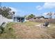 Spacious backyard with fire pit and shed at 8907 N Boulevard, Tampa, FL 33604