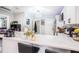 Modern kitchen with white cabinets, quartz countertops and breakfast bar at 8907 N Boulevard, Tampa, FL 33604