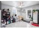 Home office with white desk, gray walls, and ceiling fan at 8907 N Boulevard, Tampa, FL 33604