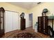 Spacious bedroom with wood flooring and ample closet space at 9341 Blind Pass Rd, St Pete Beach, FL 33706