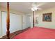 Main bedroom with a post bed, ceiling fan and ample closet space at 9341 Blind Pass Rd, St Pete Beach, FL 33706