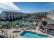 Resort-style community pool with surrounding buildings and boat docks at 9341 Blind Pass Rd, St Pete Beach, FL 33706