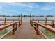 Wooden community dock extending to water at 9341 Blind Pass Rd, St Pete Beach, FL 33706