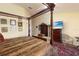 Main bedroom with four-poster bed, dresser, and wall decor at 9341 Blind Pass Rd, St Pete Beach, FL 33706