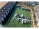 Aerial view of a marina with numerous boats and slips at 9341 Blind Pass Rd, St Pete Beach, FL 33706