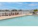 Community pool with waterfront view at 9341 Blind Pass Rd, St Pete Beach, FL 33706