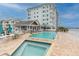 Resort-style pool and spa with waterfront view at 9341 Blind Pass Rd, St Pete Beach, FL 33706