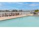 Community pool with waterfront view at 9341 Blind Pass Rd, St Pete Beach, FL 33706