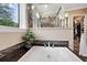 Relaxing bathroom featuring a soaking tub and walk-in shower at 2715 9Th N Ave, St Petersburg, FL 33713