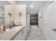 Main bathroom with granite countertop, white cabinets and shower/tub combo at 2715 9Th N Ave, St Petersburg, FL 33713