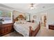 King-size bed in well-lit bedroom with ensuite bathroom access at 2715 9Th N Ave, St Petersburg, FL 33713