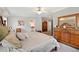 Bright bedroom with king-size bed, dresser and ensuite bathroom access at 2715 9Th N Ave, St Petersburg, FL 33713