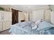 Guest bedroom with white bed frame, barn door, and carpet flooring at 2715 9Th N Ave, St Petersburg, FL 33713