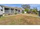 Tan house with white porch and walkway, side yard view at 2715 9Th N Ave, St Petersburg, FL 33713