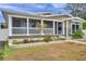 Tan house with white columns, porch, and landscaped yard at 2715 9Th N Ave, St Petersburg, FL 33713