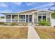 Tan house with white columns, porch, and landscaped yard at 2715 9Th N Ave, St Petersburg, FL 33713