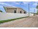 Side of house with a white vinyl privacy fence at 2715 9Th N Ave, St Petersburg, FL 33713