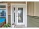 White front door with glass panels and sidelights at 2715 9Th N Ave, St Petersburg, FL 33713