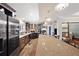 Modern kitchen featuring a long island, stainless steel appliances, and dark wood cabinets at 2715 9Th N Ave, St Petersburg, FL 33713