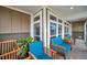 Screened porch with blue seating and potted plants at 2715 9Th N Ave, St Petersburg, FL 33713